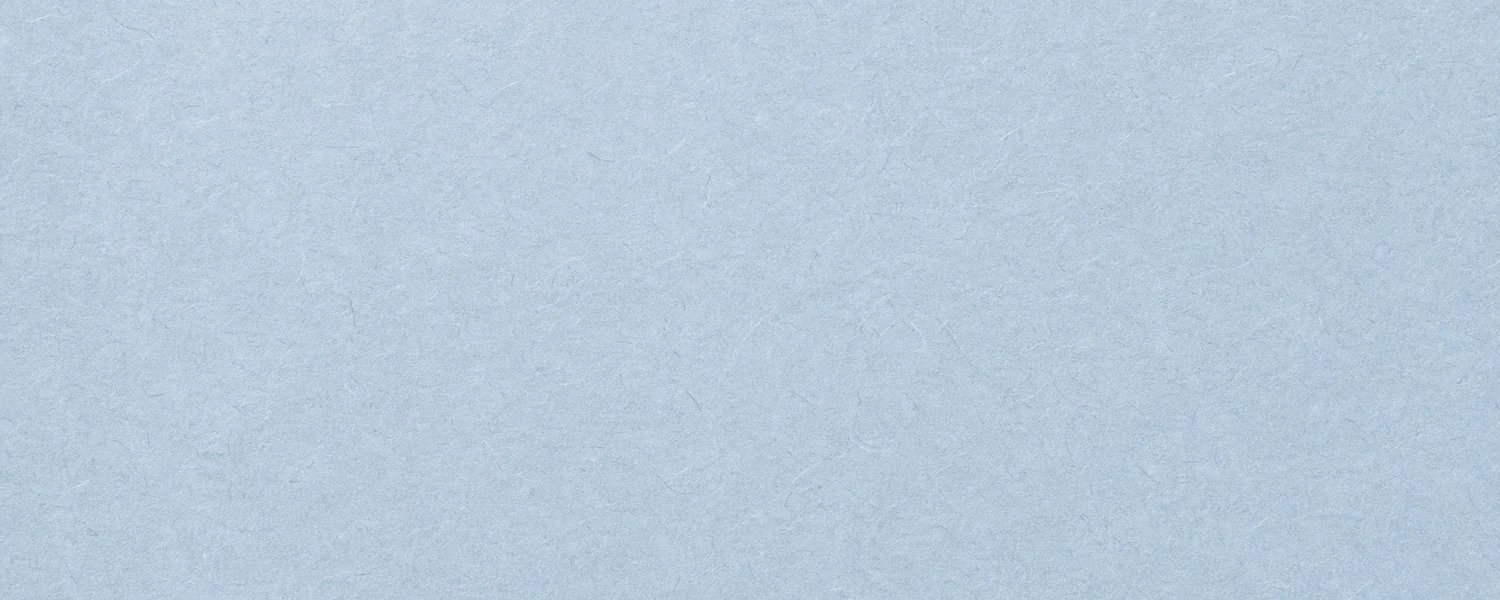 Soft blue handmade paper texture with subtle fibers