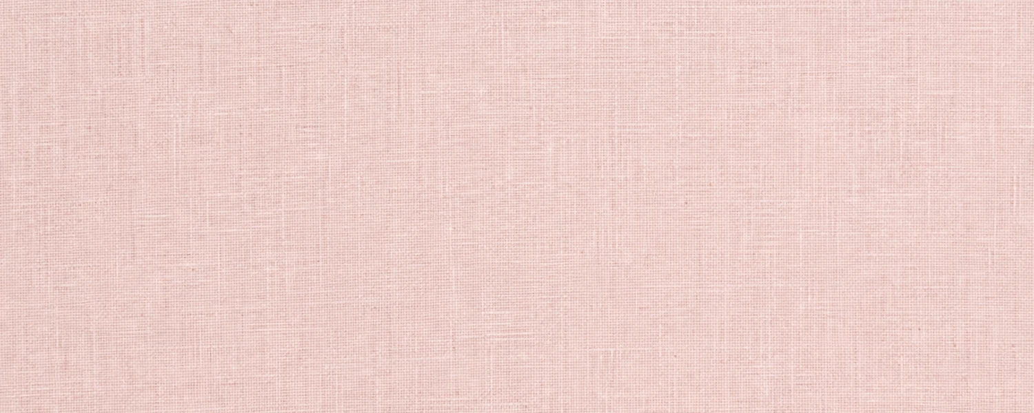 Pale blush pink linen fabric texture with a subtle weave